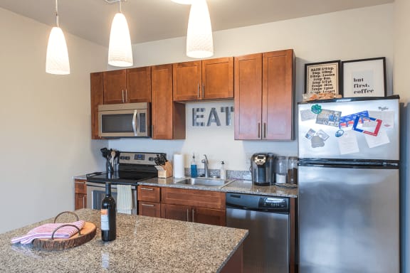 fully-equipped kitchen with stainless steel appliances at Walnut on Highland in East Liberty Pittsburgh