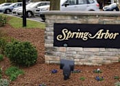 Thumbnail 2 of 5 - a sign for spring airor in front of a parking lot