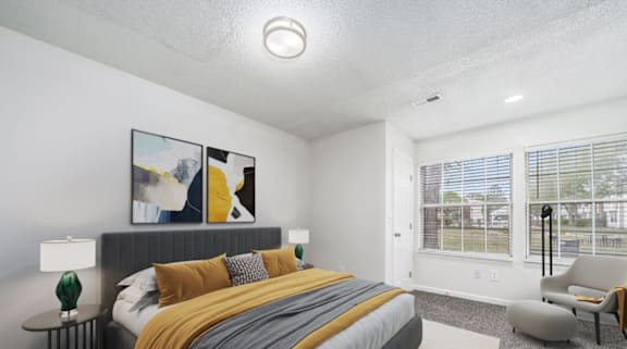 a living room with a couch chair and ottoman at The Berryessa Apartments, Columbus, OH, 98104