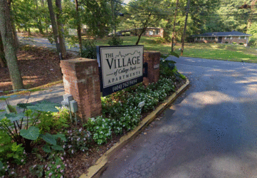 a view of the village sign from the street