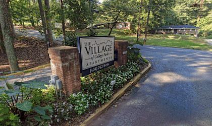a view of the village sign from the street