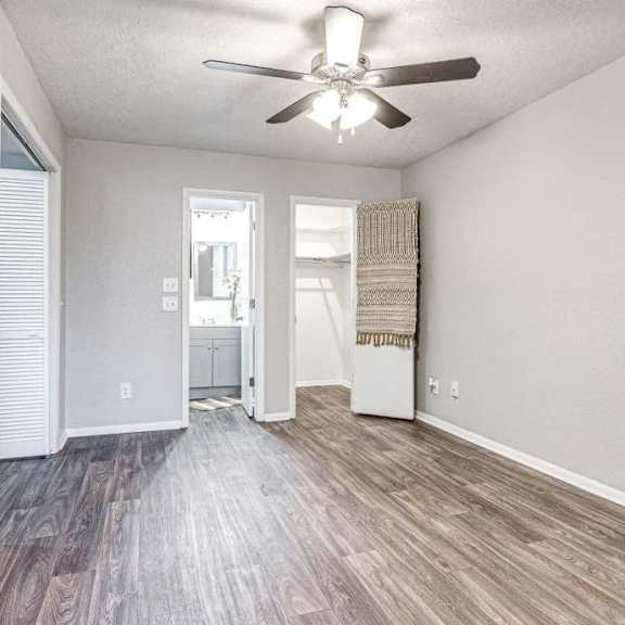 an empty living room with a ceiling fan at Diamond Ridge Apartments, Oklahoma City, OK, 73114
