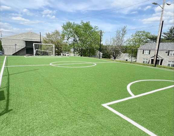 a soccer field with white lines on it