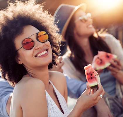 Friends eating watermelon at Banyan Pointe, Coconut Creek Florida