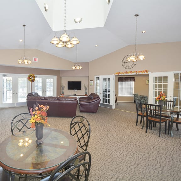 Spacious Clubhouse Lounge, Kitchen and Tables with Vaulted Ceilings