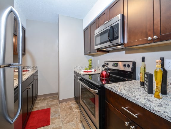 Fully-Equipped Kitchen with Granite Coutnertops