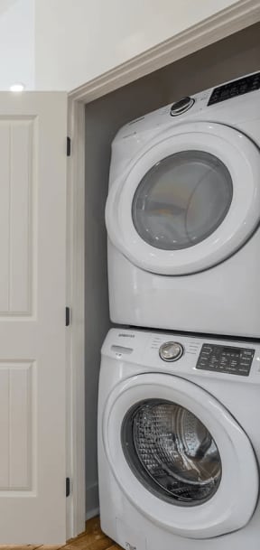 a laundry room with a front load washer and dryer