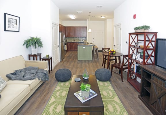 Living room with open layout and view of the kitchen