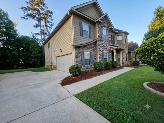A house with a garage and a driveway.
