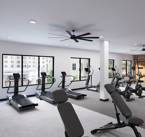 A gym with treadmills, elliptical machines, and other exercise equipment. at Refinery at Pointe17 Apartments, Phoenix, AZ, 85085
