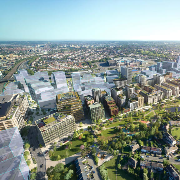 an aerial view of the university of queensland campus with the city of brisbane in