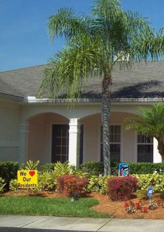 A building with a sign that says "We Care" in front of it.