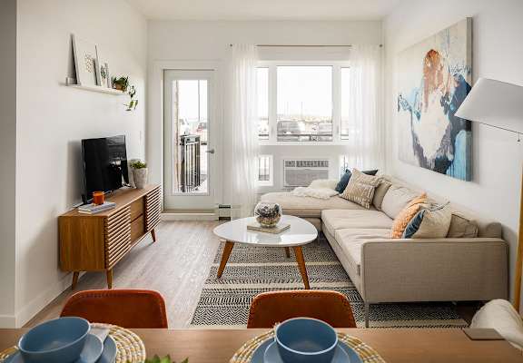 a living room with a couch and a table and a television