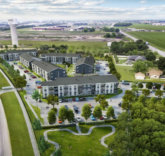 an aerial view of a building surrounded by trees and a highway at The Virginia, Texas