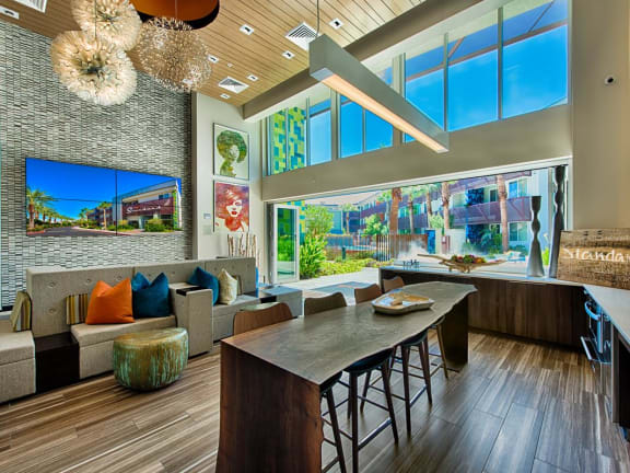 a lobby with a blue couch and wood floors