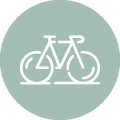 engraved bicycle illustration in a blue circle