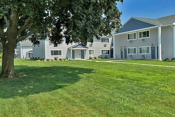 a large lawn in front of a house at Brookwood at Sayville, New York, 11782