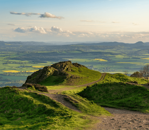 a view of the countryside from the top of a hill