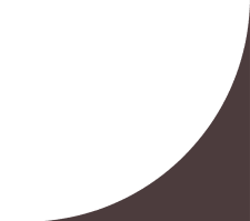 a dark room with a dark wall and a curtain