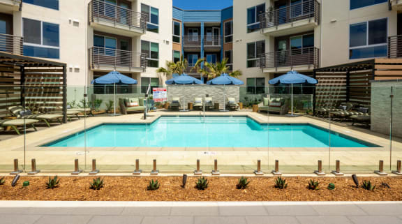 Resort-style pool with cabanas at Trition Encinitas apartments in Encinitas, San Diego
