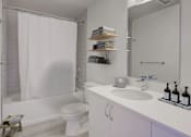 Thumbnail 7 of 8 - A white bathroom with a toilet, sink, and shower.at Sylk Towers, Kitchener