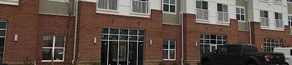 Exterior front of building with parking lot