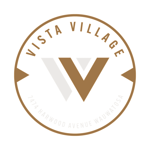 The image is a logo for Vista Village located at 174 Harwood Avenue Wauwatosa.
