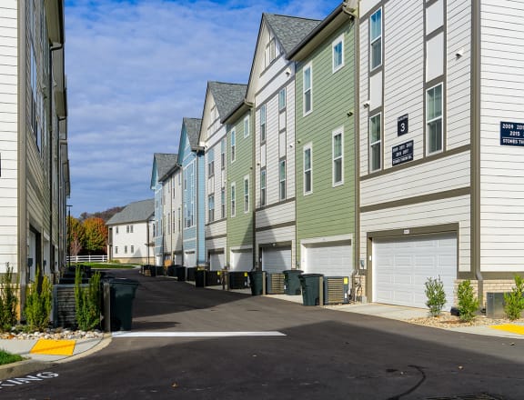 a row of houses with different colored windows  at Oakbrook Townhomes, Franklin, 37067