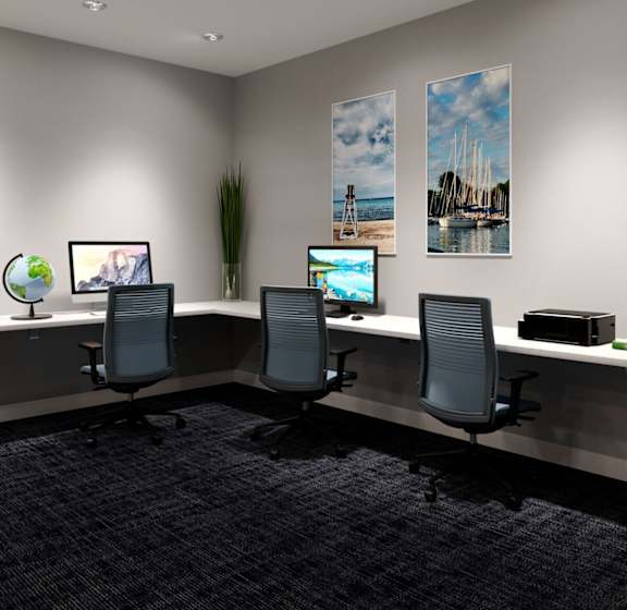 a conference room with three desks and three computer monitors at The Residences of Wilmette, Wilmette, Illinois