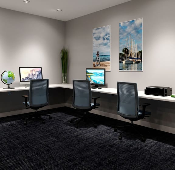 a conference room with three desks and three computer monitors at The Residences of Wilmette, Wilmette, Illinois