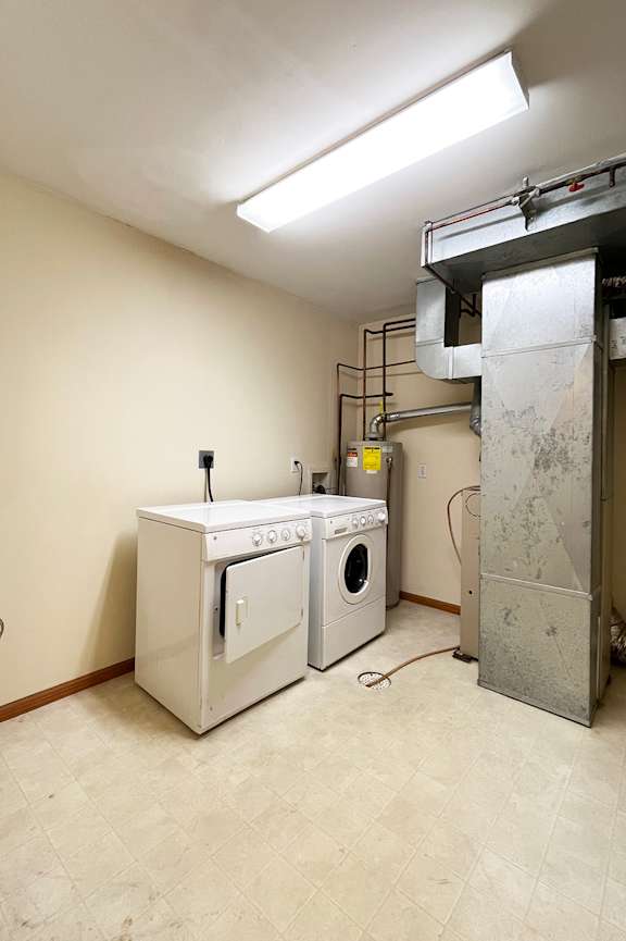 a bathroom with a toilet and a sink and a bath tub