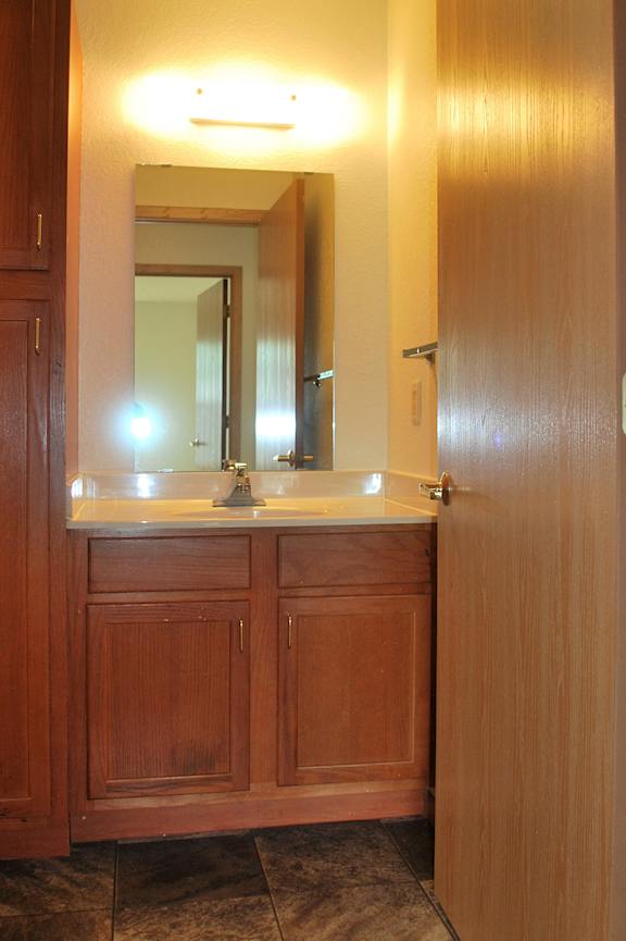 a bathroom with a toilet and a sink and a bath tub
