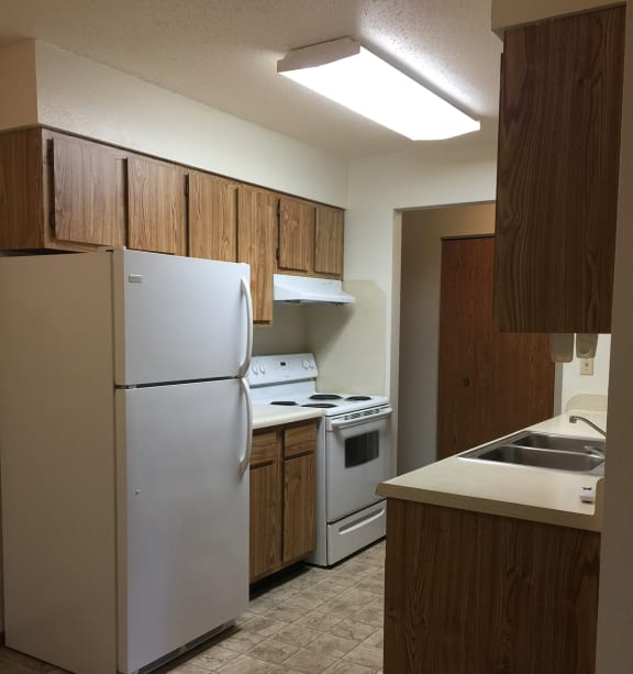 a bedroom with a bed and a ceiling fan