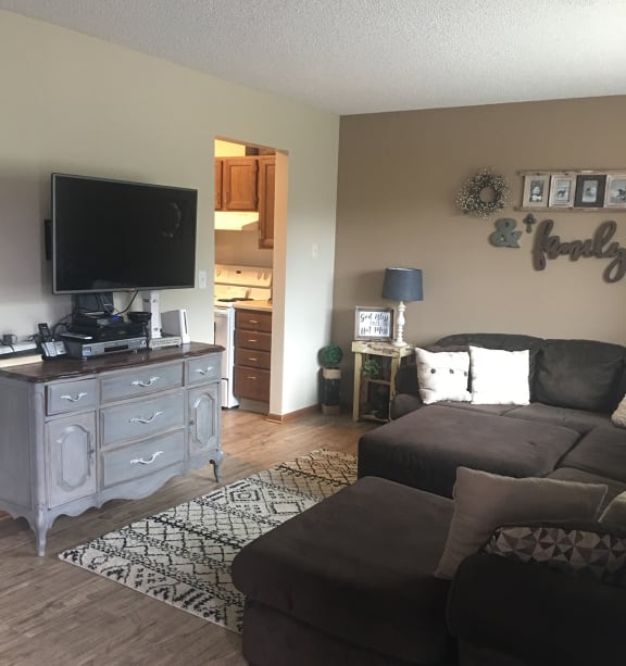 a bedroom with a bed and a ceiling fan