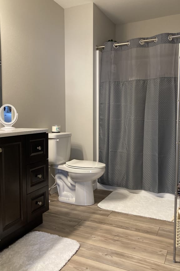 a bathroom with a toilet and a sink and a bath tub