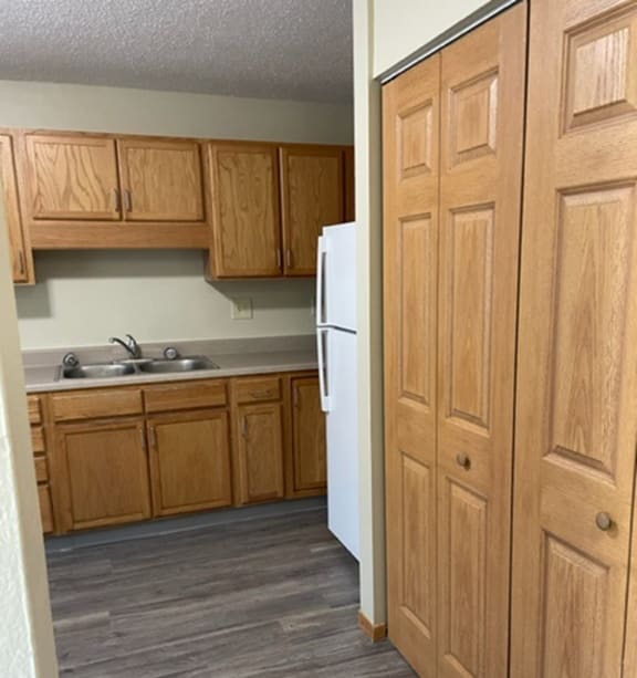 a bedroom with a bed and a ceiling fan