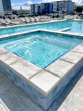 A small pool with a blue tiled edge.