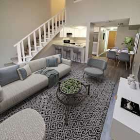 a view of a living room and dining room with a staircase