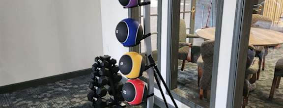 a grouping of weights in a room with mirrors