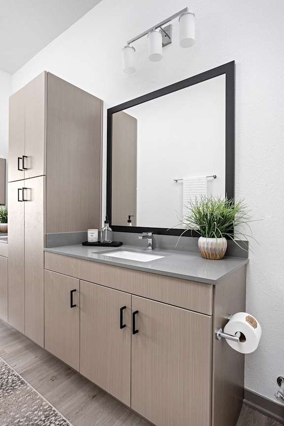 a bathroom with a sink and a mirror  at Slate at Fishers District, Fishers, Indiana