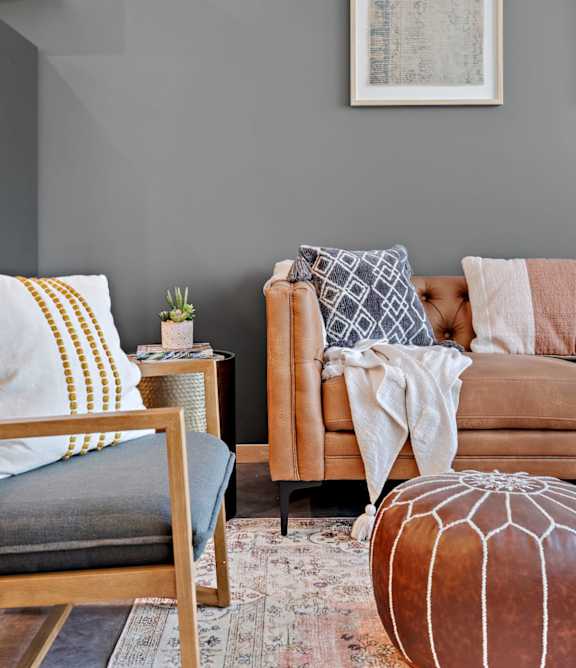a living room with a couch and a table at Zelia on Seven, St Louis Park, MN