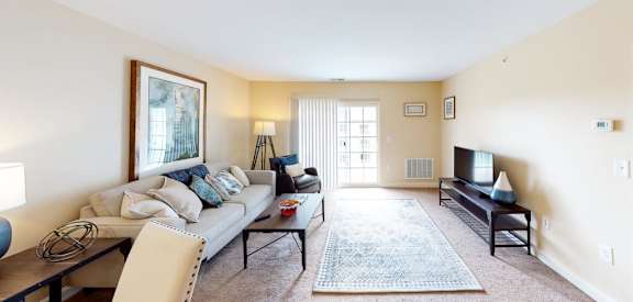 a living room with a couch and a tv
