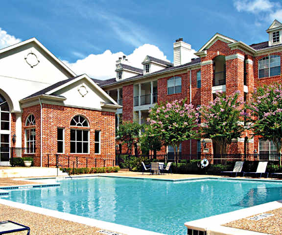 img src="swimming pool.png" alt=courtyard with swimming pool & lounge chairs outside brick building"