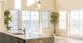 Kitchen counter top and sink with living room water view