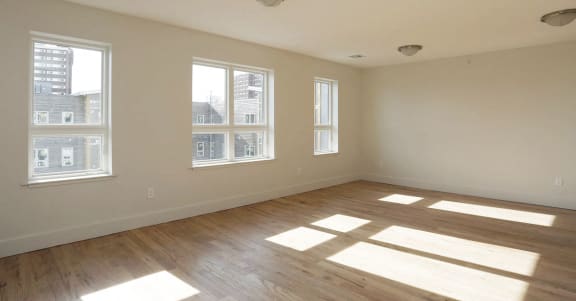 living room with white walls and hardwood floors
