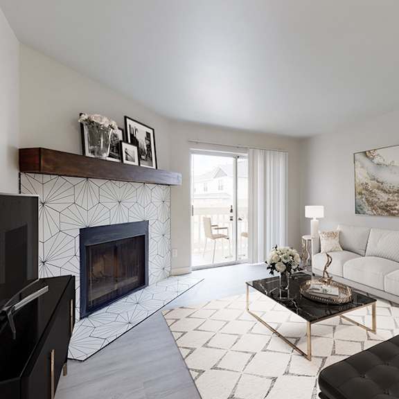 A living room with a fireplace and a couch.