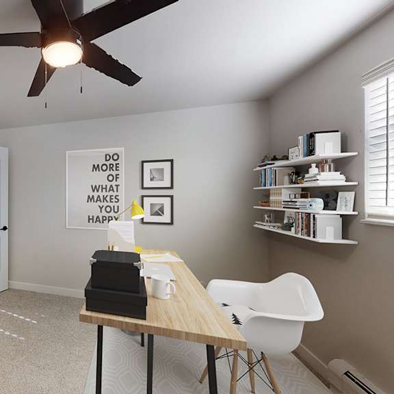 A room with a ceiling fan and a table with a plant and a box on it.