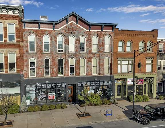 A street view of a row of buildings at The Granite Works Apartments , Buffalo, 14202