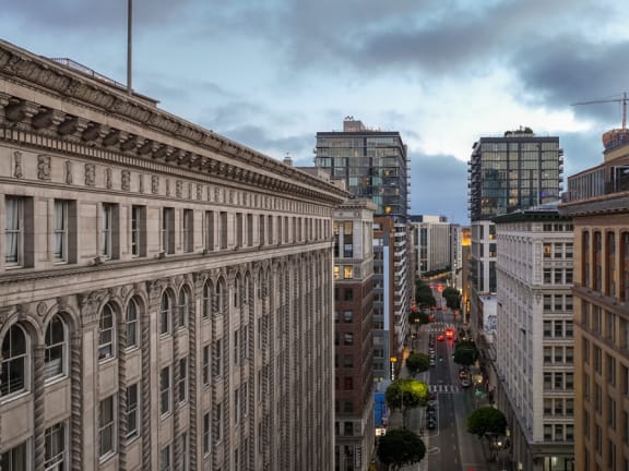 a view of a city street from the roof of a building