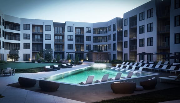 a rendering of an apartment complex with a pool and lounge chairsat The Flats & Terraces at Wildhorse Village, Missouri